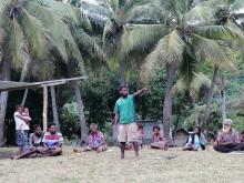 A community member making a statement during the awareness program